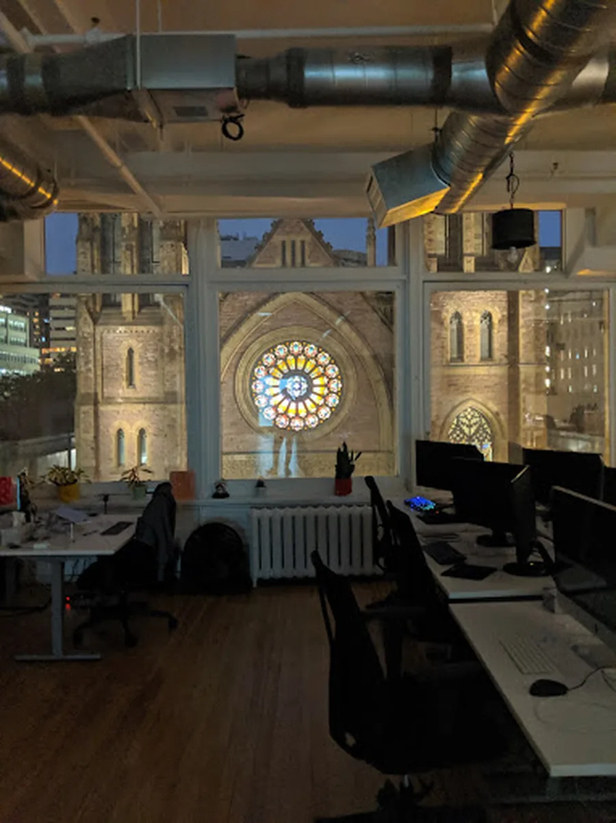 Workstations overlooking Christ Church Cathedral from the Webisoft office